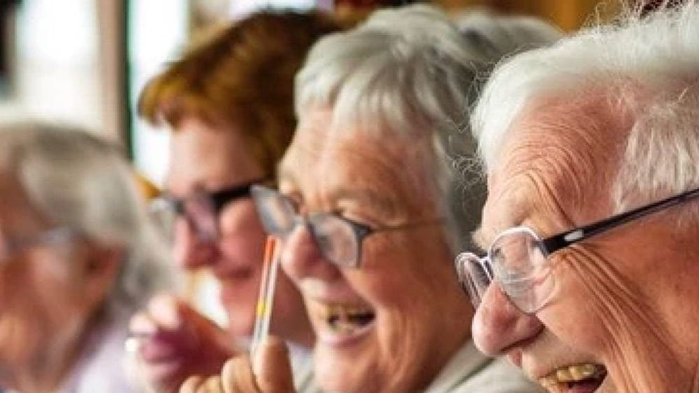 Residents laughing together during a group activity